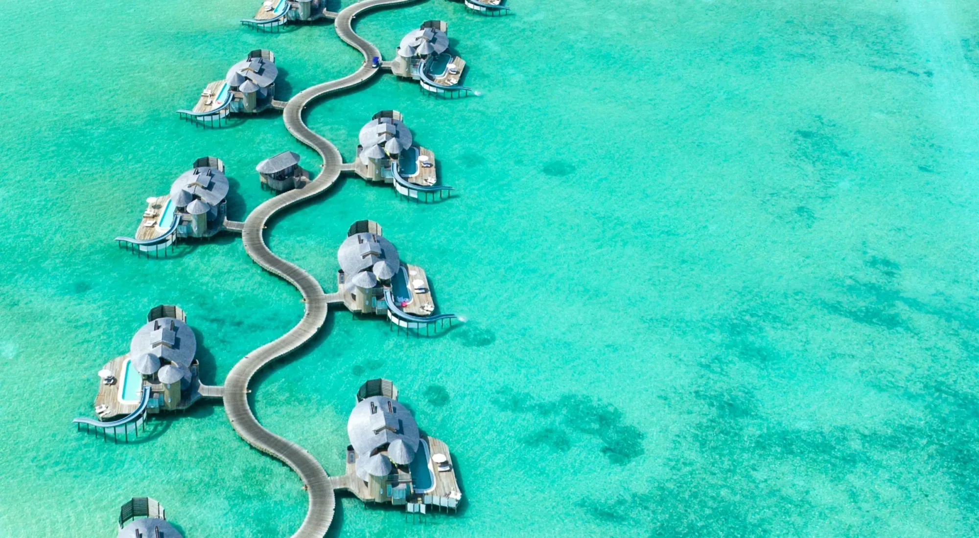 Overwater villas on a Maldivian atoll