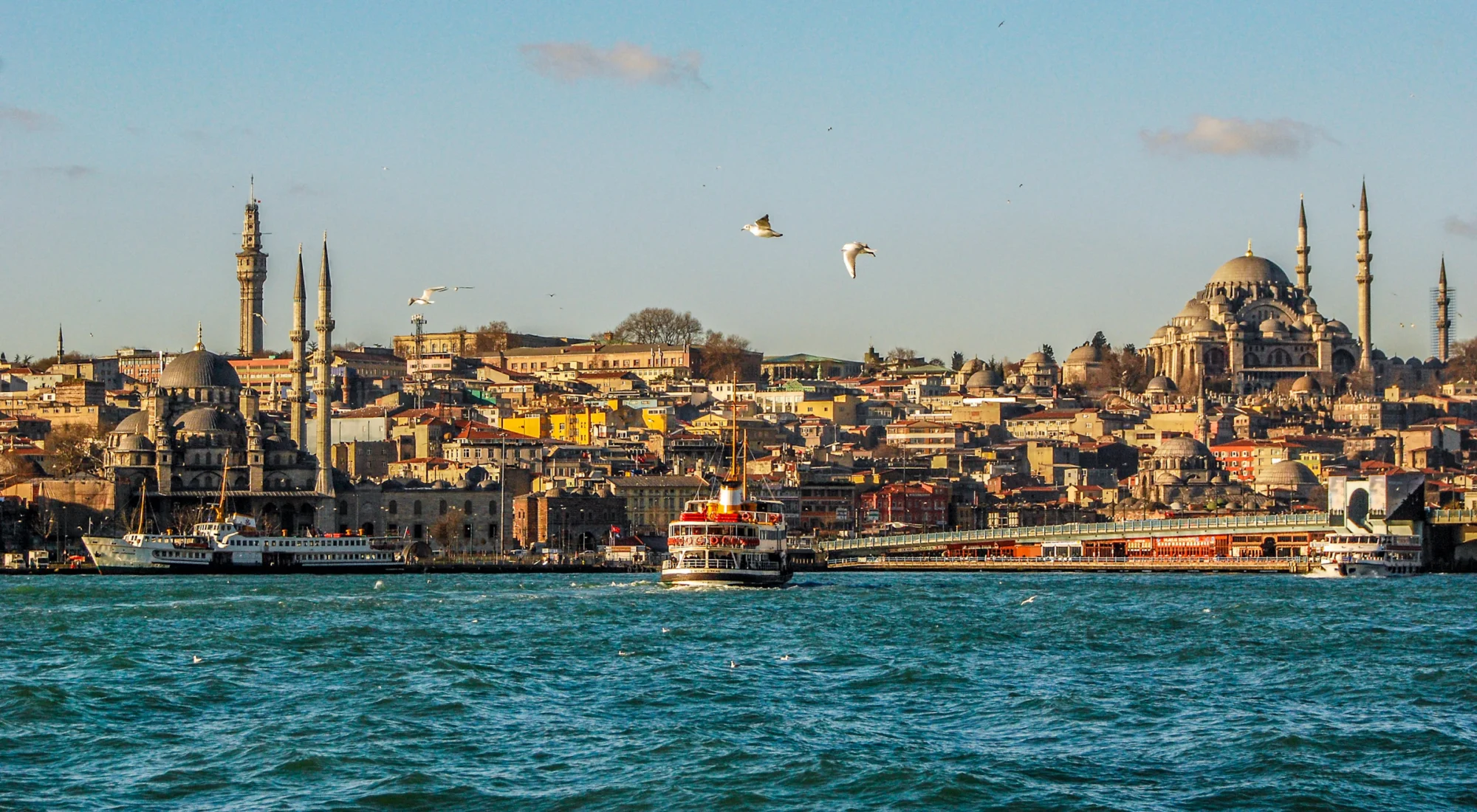 A ferry crossing the Bosphorus towards the Istanbul skyline