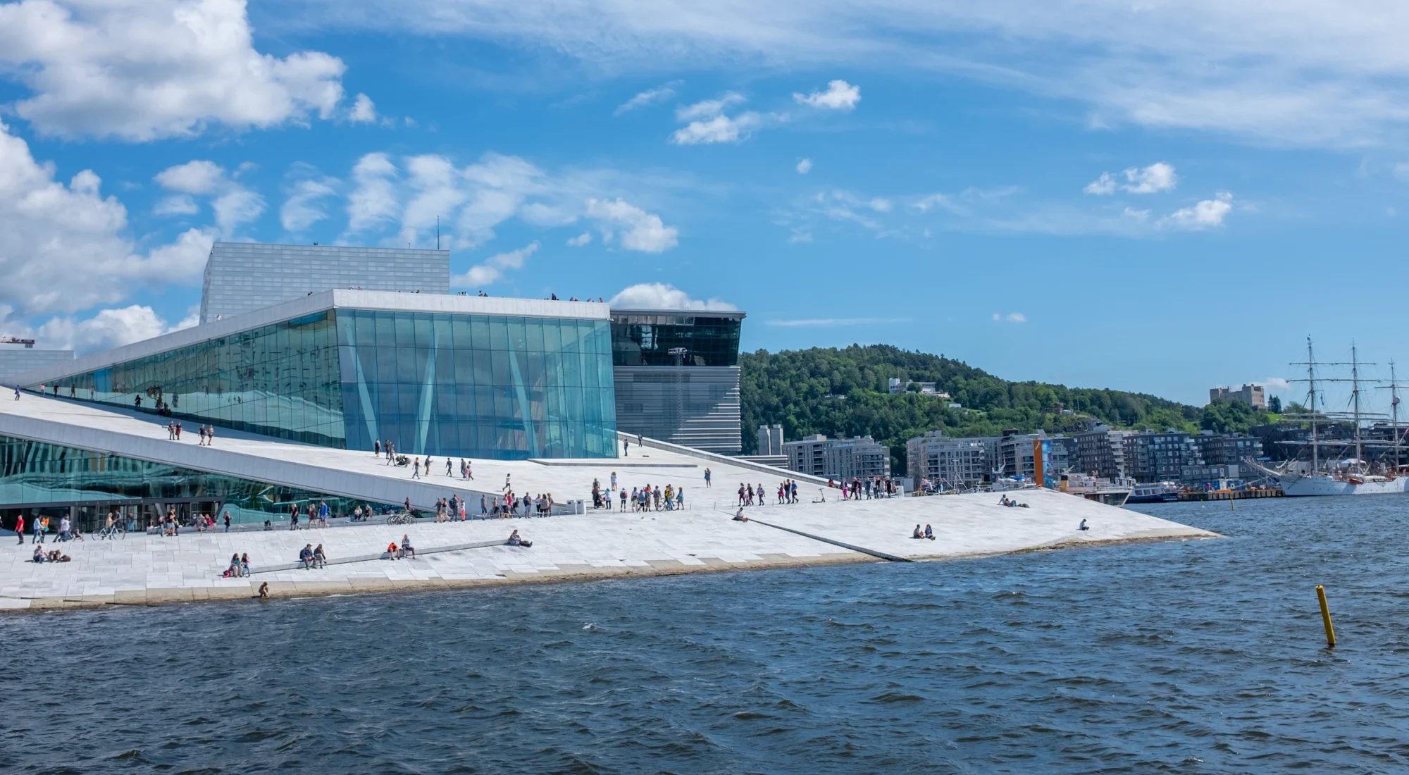 People on the sloping roof of the Oslo Opera House