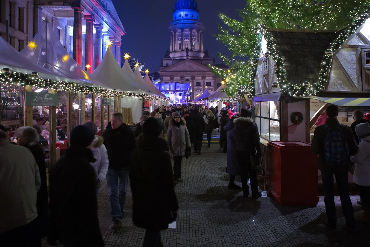 Christmas market stalls on a Berlin square at night