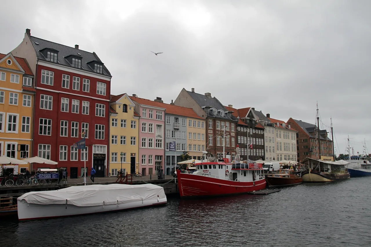 Painted townhouses and boats along Nyhavn, Copenhagen